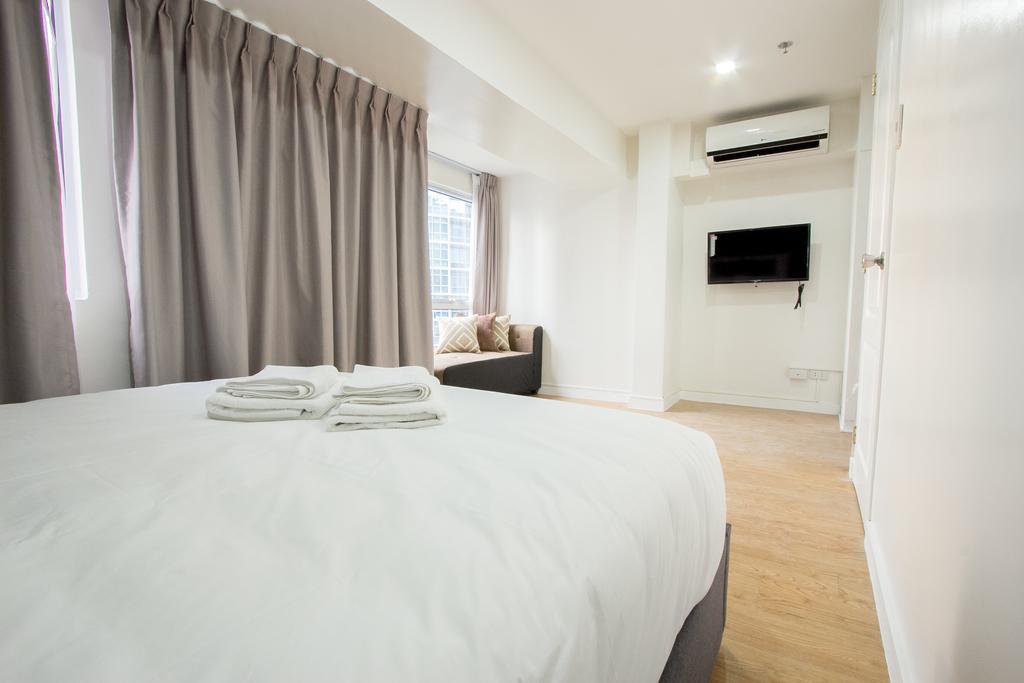 טאגיג Oasis Regency @ Fort Victoria Bgc מראה חיצוני תמונה